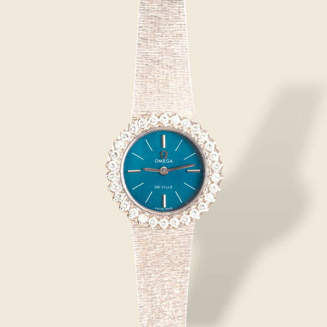 Montre Omega vintage or gris et diamants OO7 Savaje Paris