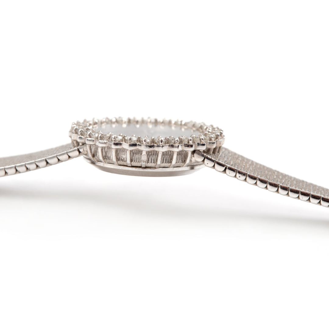 Montre Omega vintage or gris et diamants OO7 Paris