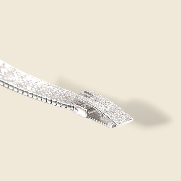 Montre Omega vintage or gris et diamants OO7 