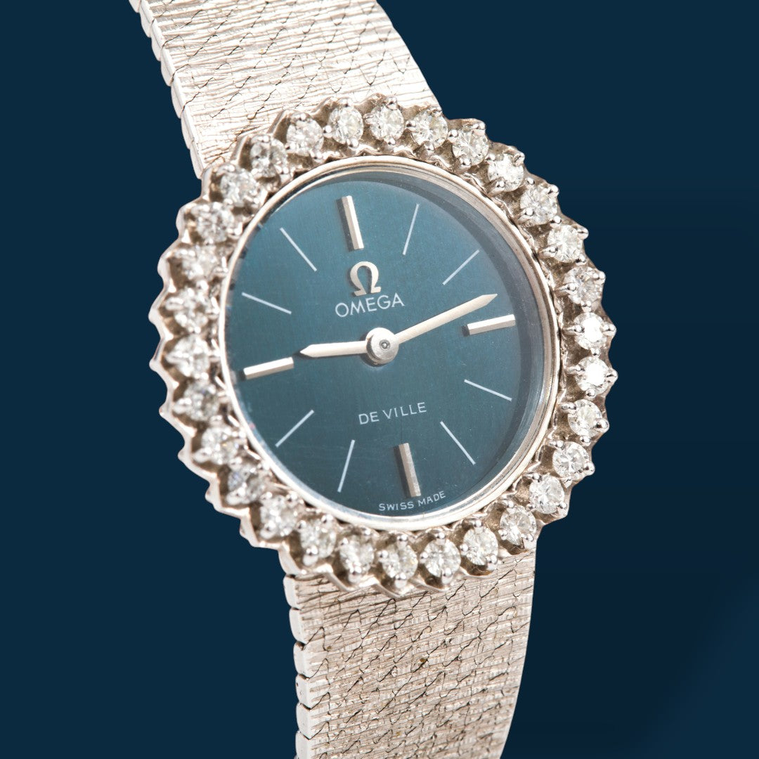 Montre Omega vintage luxe or gris et diamants OO7 Savaje Paris