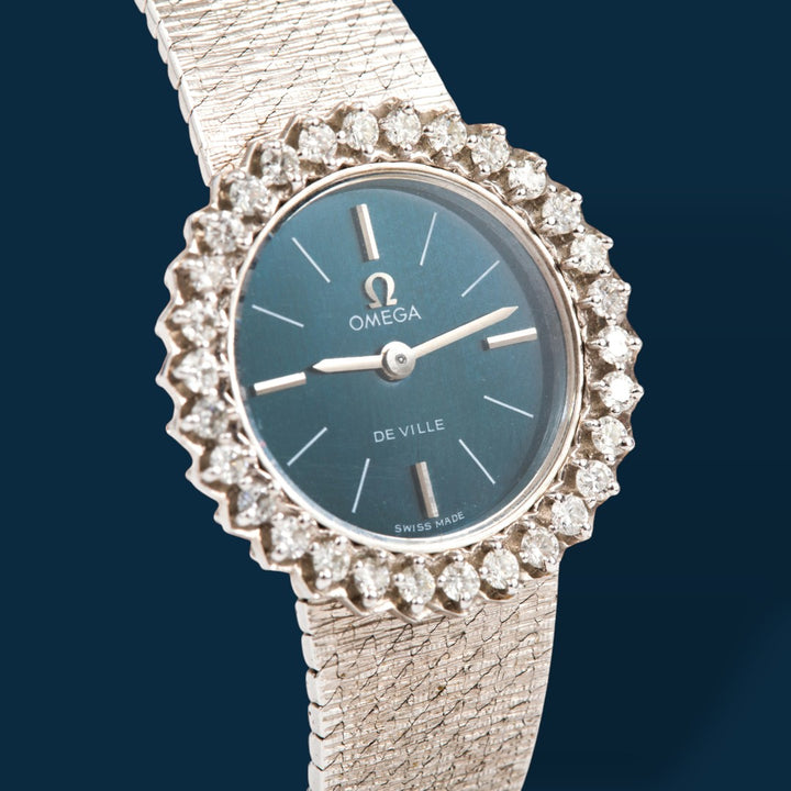 Montre Omega vintage luxe or gris et diamants OO7 Savaje Paris